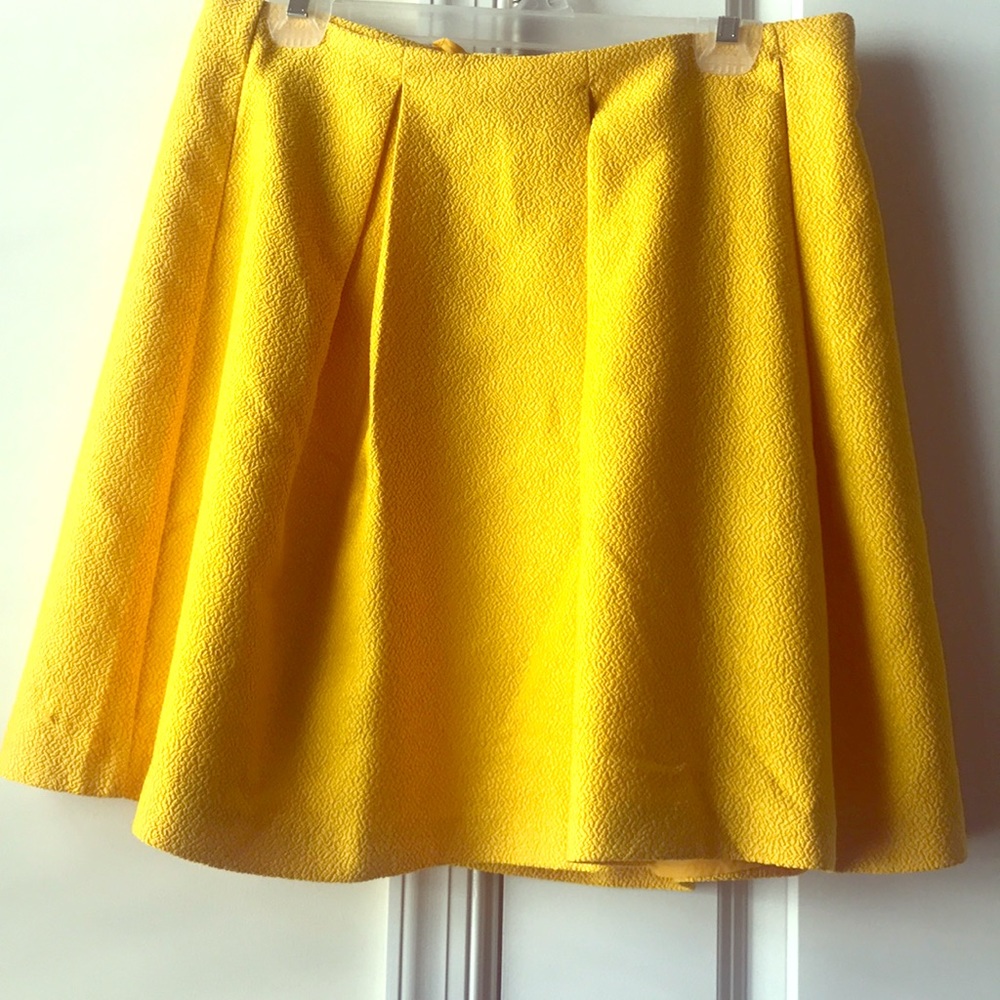 Yellow pleated skirt